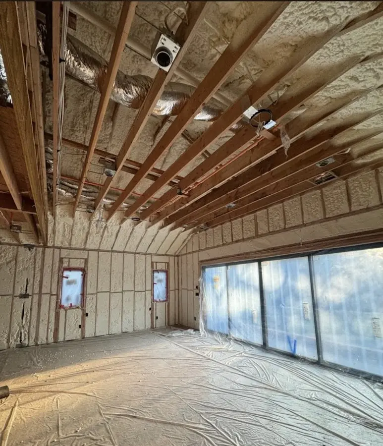 Interior walls and ceiling insulated with spray foam during new construction in Berthoud